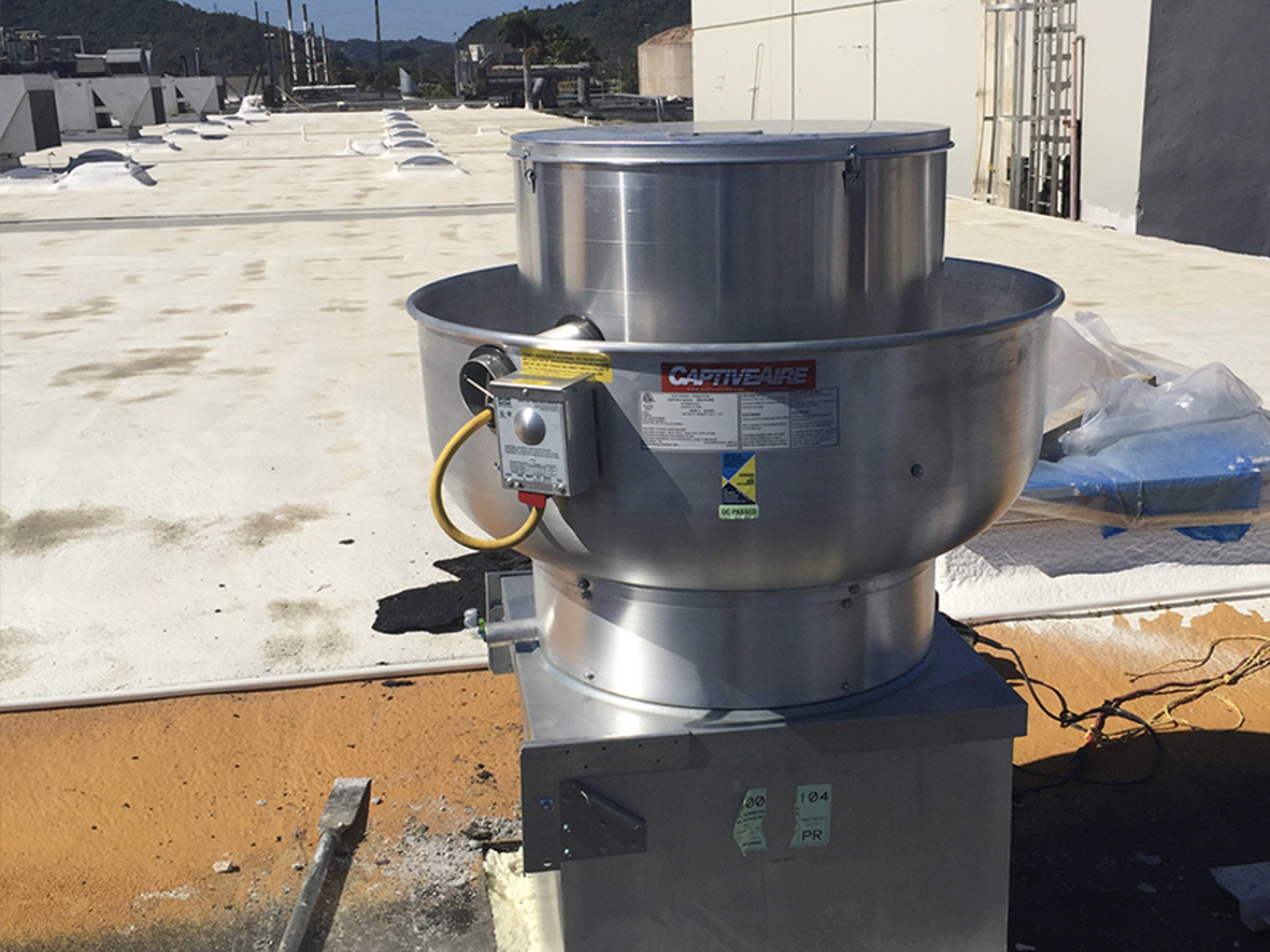 industrial ac units installed on the roof of a building